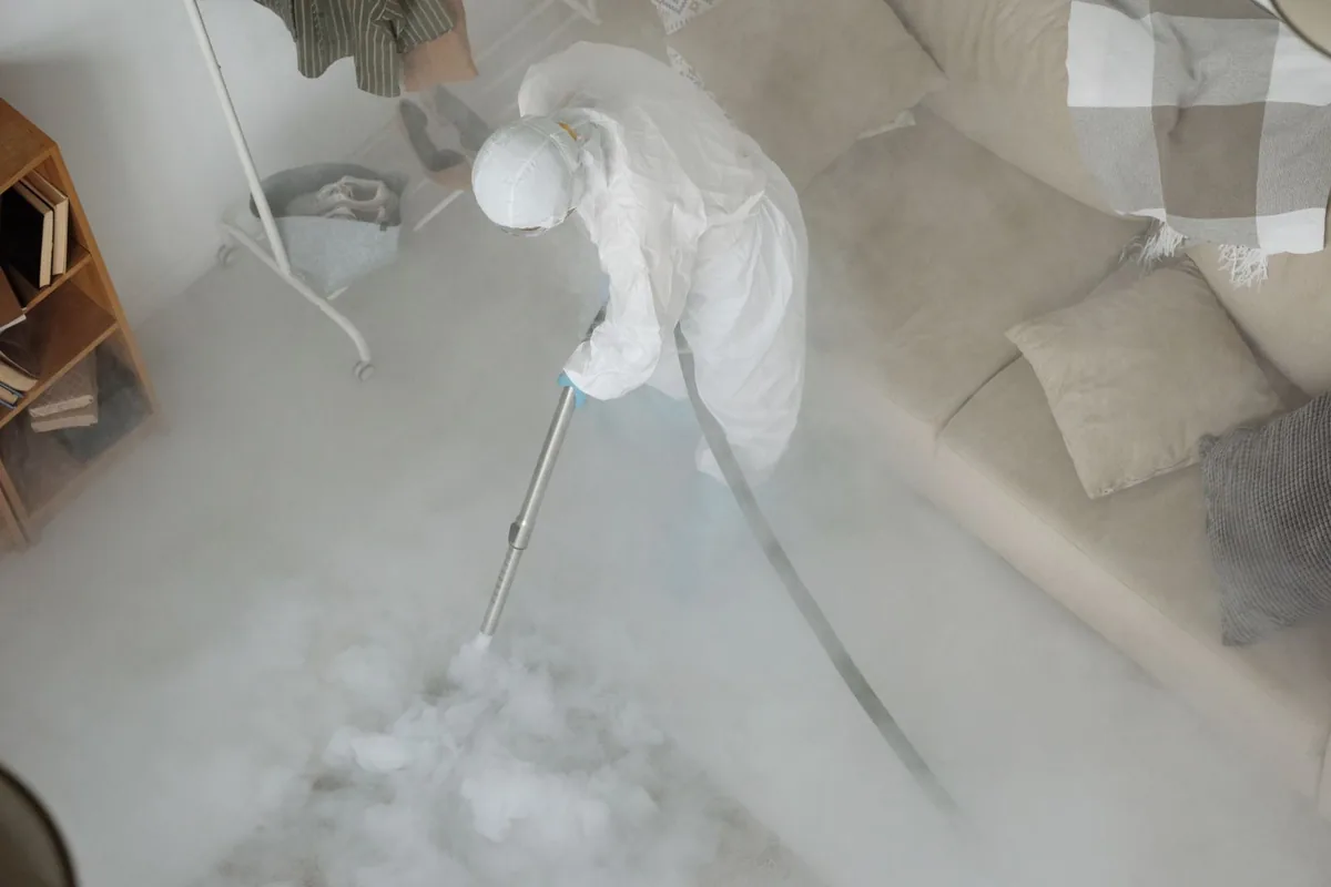 Biohazard cleanup technician in protective equipment, Hagan, GA